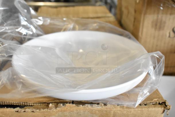 White melamine bowl wrapped in plastic on cardboard box, part of new scratch and dent auction lot.