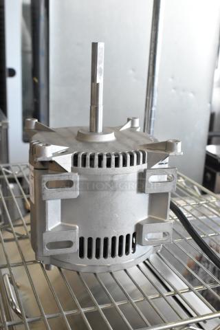 Brand new motor with light scratches and dents, uninstalled condition, silver finish, visible mounting brackets.