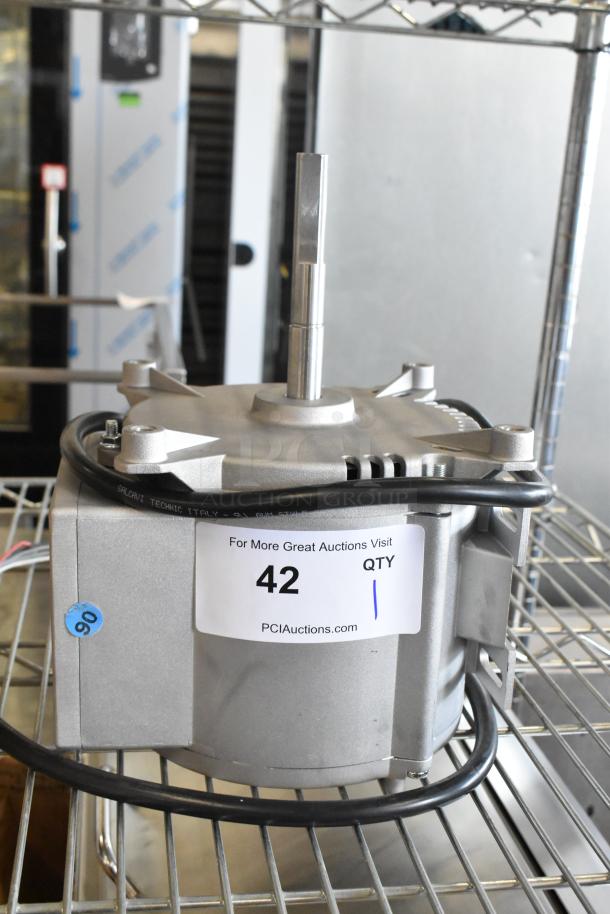 Brand new motor with minor scratches, visible label "42," PCI Auctions, Salcavi Technic Italy markings.