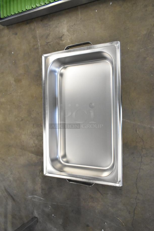 Brand new stainless steel chafer with minor scratches and dents. Features stainless handles and rectangular design.