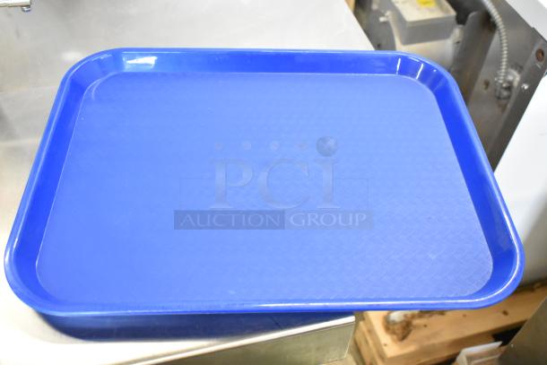 11 new Choice 999FT1418BL blue poly food trays, slight imperfections, durable design for food service.