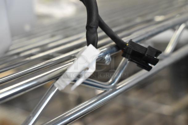 New pump with minor scratches and dents, featuring black and white electrical connectors. Ideal for replacement or repair.