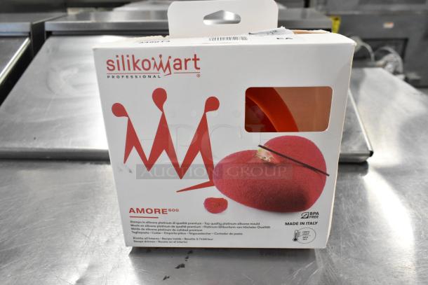 Brand new Silikomart Amore heart-shaped silicone baking mold with cutter, 5 1/2" x 5 5/16" x 1 7/8", scratch and dent.