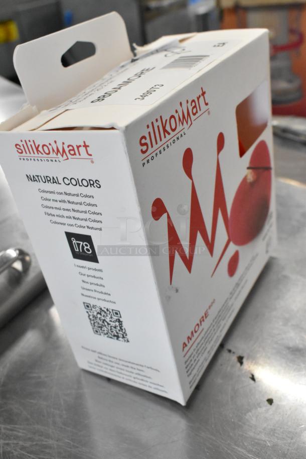 Box of BRAND NEW Silikomart AMORE heart-shaped silicone baking mold with cutter, minor box damage, 5 1/2" x 5 5/16" x 1 7/8" cavity.