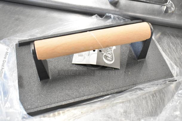 "Brand new Choice 471SWCI95 cast iron steak weight, 9x5 inches, with wooden handle, scratch and dent condition."