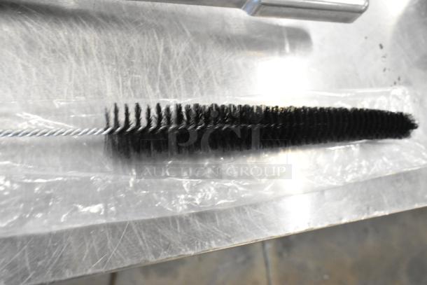 Brand new wire cleaning brush, SKU311731, scratch and dent condition, sealed in plastic, black bristles.
