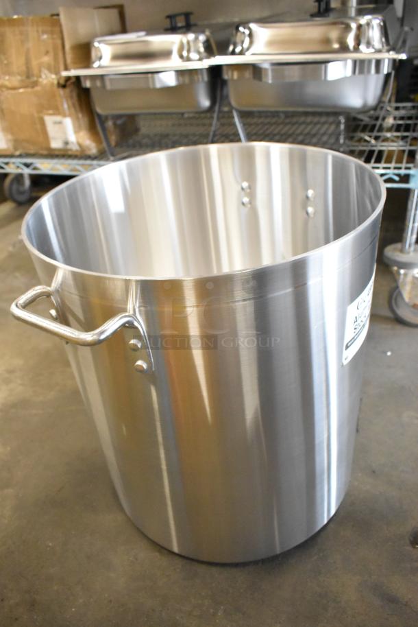 BRAND NEW SCRATCH AND DENT! Choice 471SP60QT 60 Qt. aluminum stock pot with minor scratches. Durable with riveted handles.