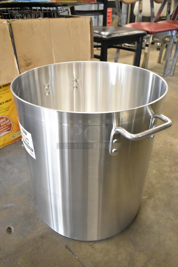 Brand new Choice 471SP60QT 60 Qt. aluminum stock pot with minor scratches, durable handles, and standard weight construction.