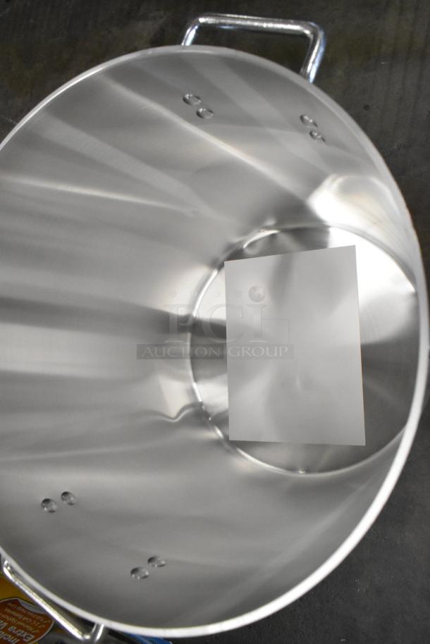 Brand new 60 Qt. Choice 471SP60QT aluminum stock pot, standard weight, slight scratch and dent, sturdy handles visible.