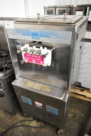 Taylor 339-27 Stainless Steel Commercial Floor Style 2 Flavor w/ Twist Soft Serve Ice Cream Machine on Commercial Casters. 208-230 Volts, 1 Phase. - Item #1202971
