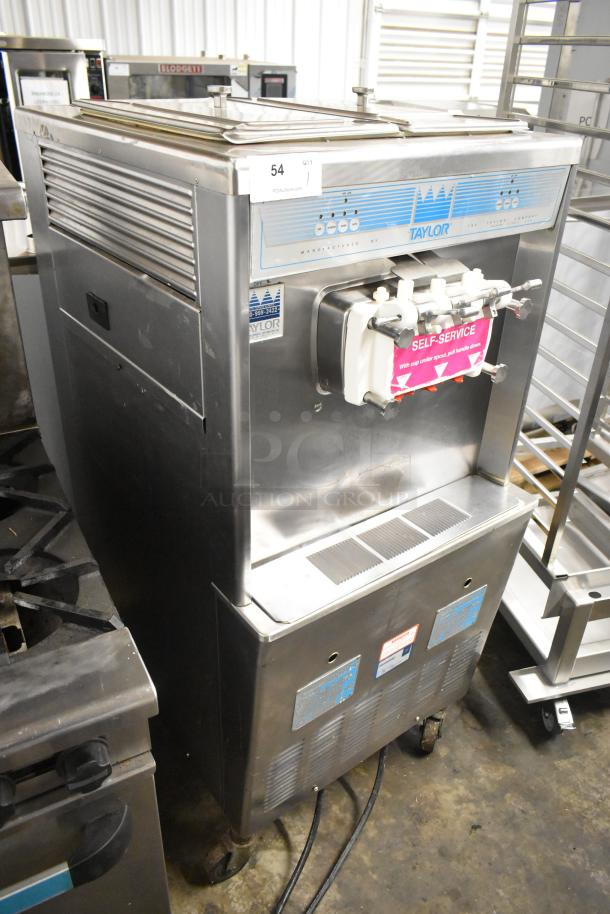 Taylor 339-27 stainless steel commercial soft serve ice cream machine with two flavors and twist, on casters, 208-230V, 1 phase.
