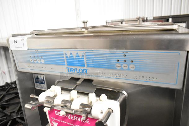 Taylor 339-27 stainless steel soft serve ice cream machine, 2 flavors with twist, on casters, 208-230V, 1 phase, commercial use.