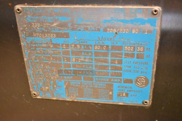 Taylor 339-27 stainless steel soft serve machine label, showing specs. Model supports 208-230V, single phase power.