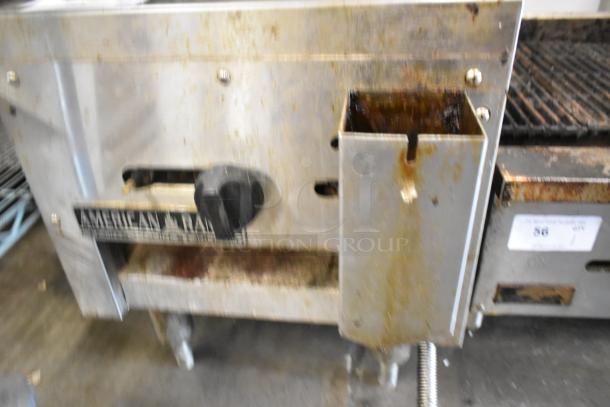 American Range stainless steel gas-powered single burner range. Features include adjustable knob, visible wear, and brand label.