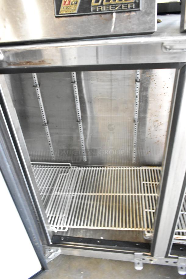 Glastender ND72-R1-BN(LLR) 3-door metal back bar cooler, 115V, 1 phase. Interior shelving visible, shows some wear.