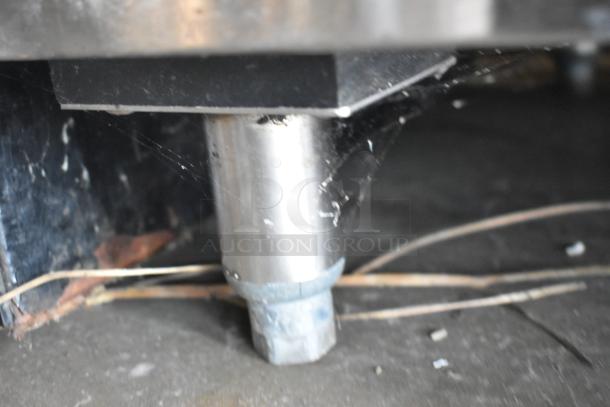 The image shows the base and leg of a Glastender ND72-R1-BN(LLR) back bar cooler, indicating used condition.
