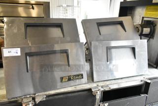Four True stainless steel commercial freezer drawers. Slight wear, labels indicate True Freezer brand, ideal for undercounter installation.