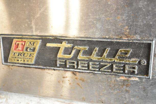 True undercounter freezer stainless steel label, worn condition, from True Manufacturing Company.