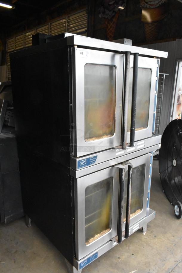 Duke stainless steel commercial convection ovens with view-through doors, metal racks, and thermostatic controls.