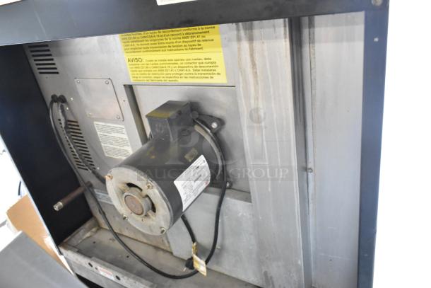 Duke stainless steel commercial convection oven, gas powered, with view-through doors, metal racks, and thermostatic controls.