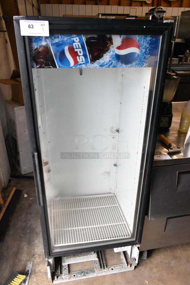 True GDM-12 single door cooler merchandiser, 115 volts, 1 phase; used condition with Pepsi branding, model details.