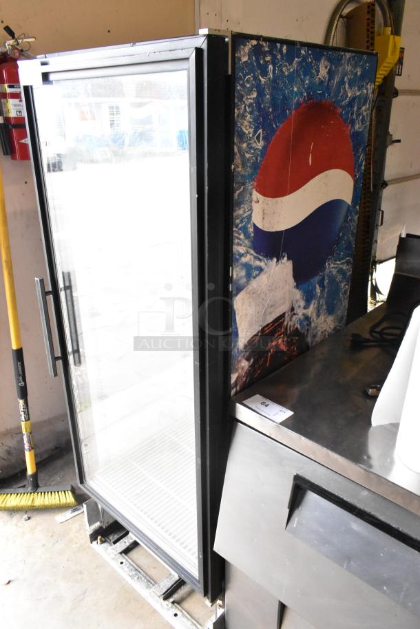 True GDM-12 commercial single door cooler merchandiser, 115 volts, metal frame, Pepsi branding on the side.