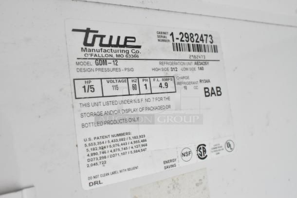 True GDM-12 cooler label; 115 volts, 1 phase, NSF certified, R134A refrigerant. Serial number 1-2982473.