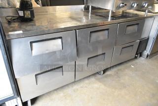 True TWT-93D-6 stainless steel undercounter cooler with 6 drawers on commercial casters. 115V, 1 phase.