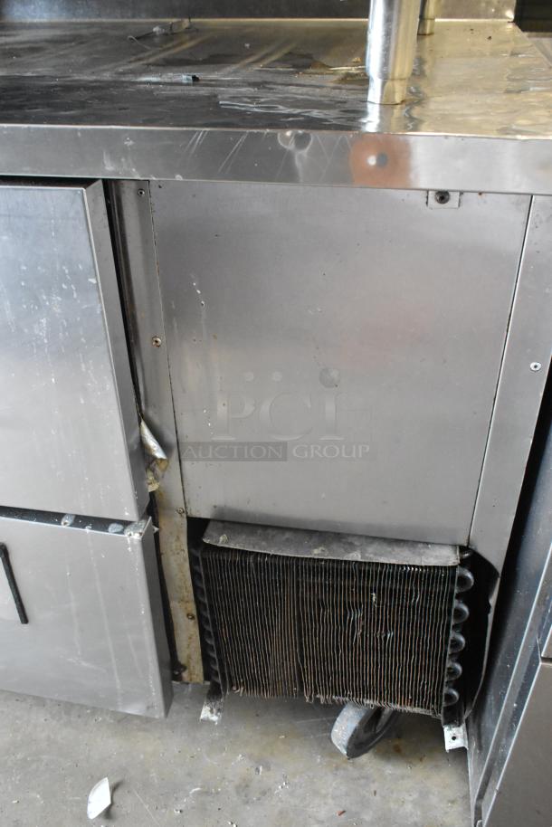 True TWT-93D-6 stainless steel undercounter cooler with 6 drawers, commercial casters, 115 volts, 1 phase, visible wear.