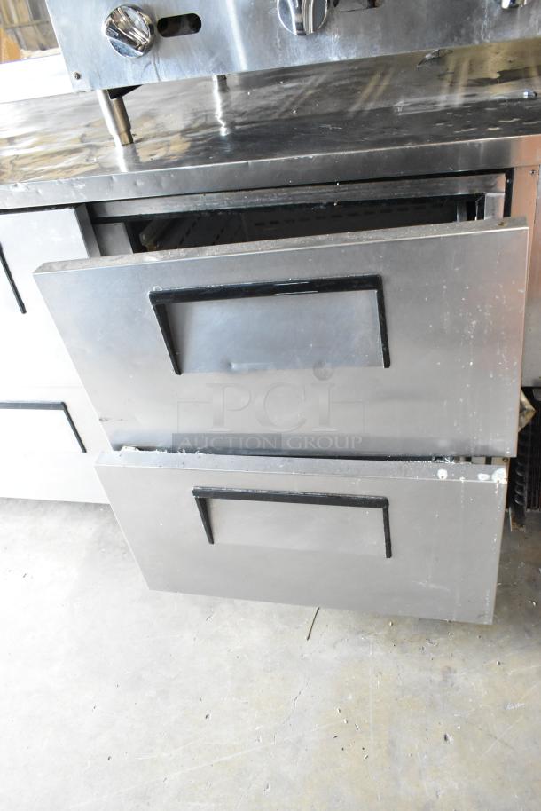 True TWT-93D-6 stainless steel undercounter cooler, 6 drawers on commercial casters, 115V, 1 phase, minor wear.