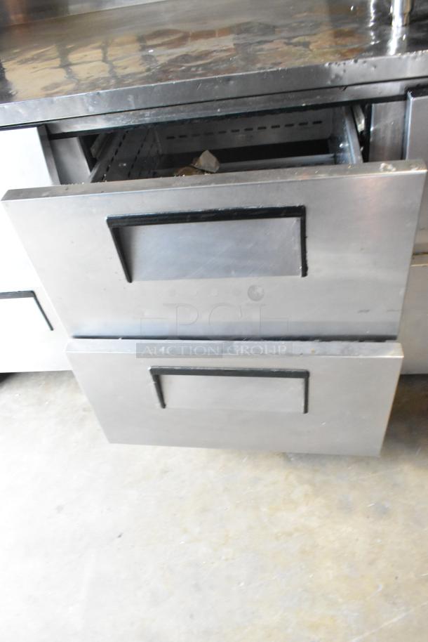 True TWT-93D-6 stainless steel commercial cooler with 6 drawers, on casters, showing drawer detail. 115V, 1 Phase.