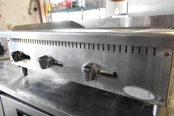 Atosa stainless steel countertop gas charbroiler grill, three control knobs, brand logo, commercial-grade condition.