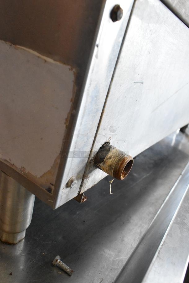 Atosa stainless steel commercial countertop gas charbroiler grill in used condition; visible rust and wear on fittings.