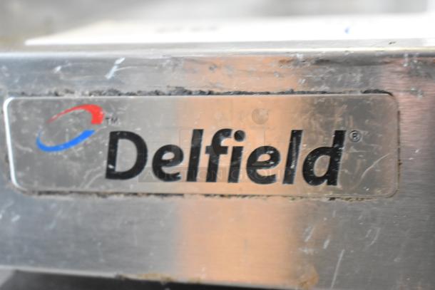 Delfield UCD4464N-12-DD5 stainless steel prep table label, features Bain Marie top with 4 drawers, 115V, 1 phase.