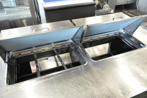 Delfield UCD4464N-12-DD5 stainless steel sandwich salad prep table, open compartments, 4 drawers, commercial use.