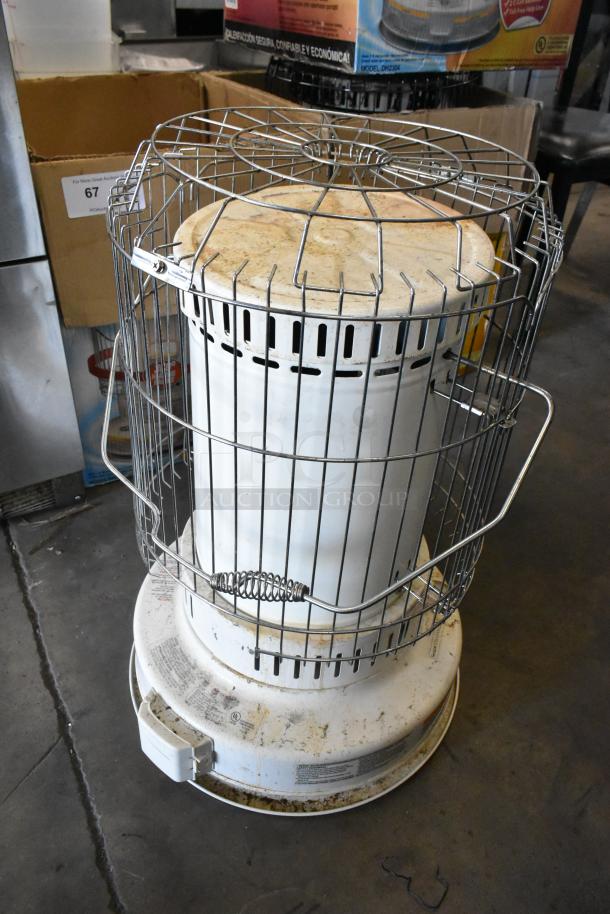 Dura Heat DH-D kerosene-fired heater, floor style. Features a protective metal cage and visible wear. Ideal for large spaces.