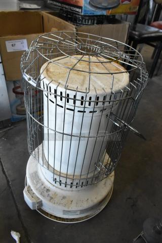 Two Dura Heat DH-D floor style kerosene heaters, metal casing, visible wear, with labels. Auction item, bid doubles quantity.