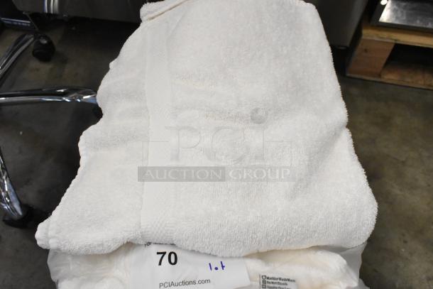 Lot of Golden Touch white towels, pristine condition, soft texture. Includes care label; ideal for luxury use.
