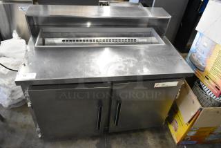 Migali CA-4-12 stainless steel commercial prep table, missing lid. Features Bain Marie top, 115V, 1 phase, good condition.