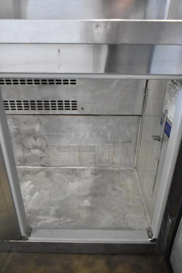 Migali CA-4-12 stainless steel prep table, missing lid. Visible internal fridge space, label indicates 115V, 1 phase power.