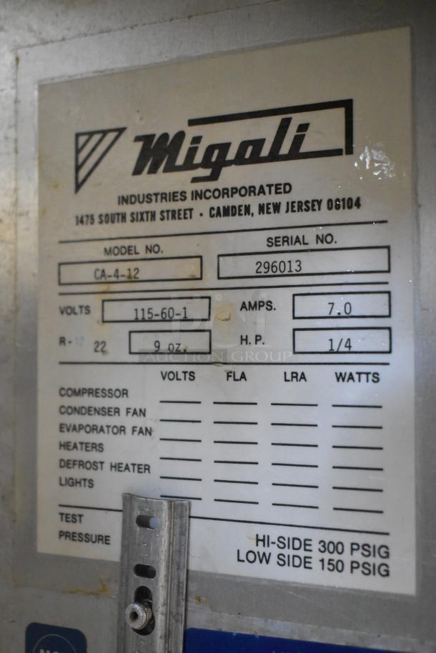 Migali CA-4-12 stainless steel prep table label. Features: 115 volts, 1 phase, missing lid, serial 296013.
