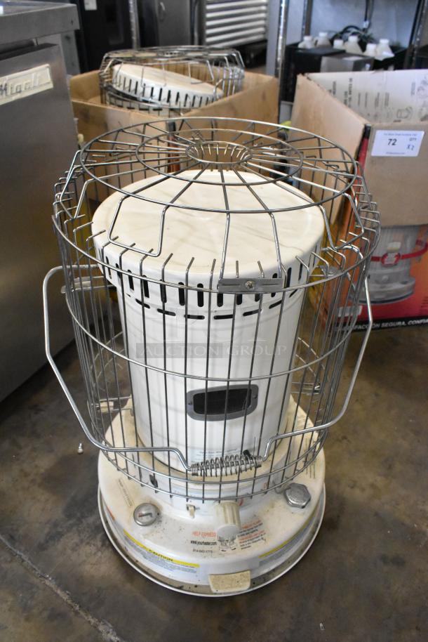 Two Dura Heat DH-D kerosene heaters, floor style, metal cage, white body, controls labeled, good condition, auction item.