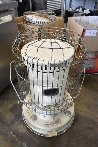Two Dura Heat DH-D kerosene heaters, floor style, metal cage, white body, controls labeled, good condition, auction item.