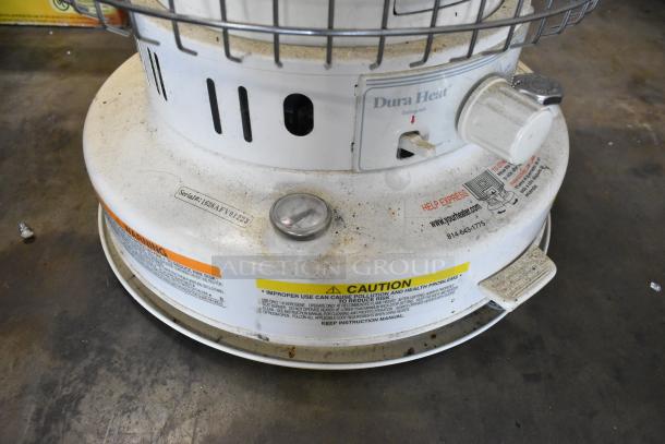 2 Dura Heat DH-D kerosene heaters with visible knobs and caution labels. Used condition with serial number 1628AFV01293.
