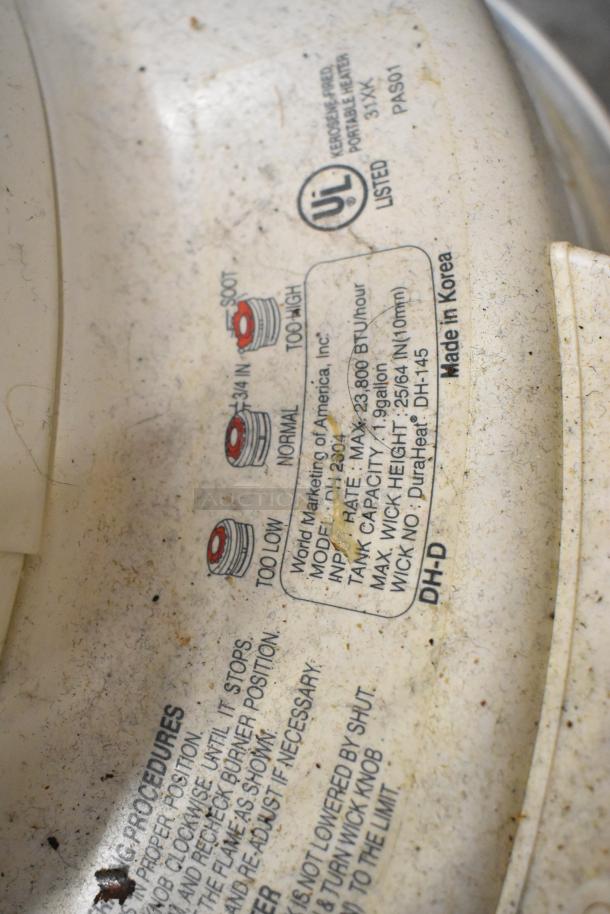 2 Dura Heat DH-D kerosene heaters, used condition, 23,800 BTU/hour. Labels show model info and settings. Made in Korea.