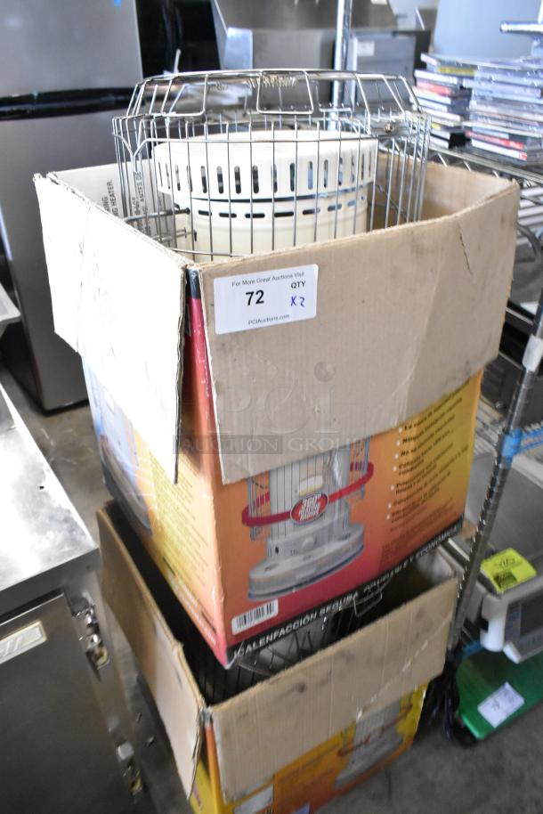 Two Dura Heat DH-D floor-style kerosene heaters in original boxes, slightly worn. Auction quantity label: 72, QTY x2.