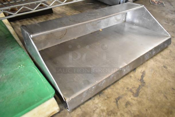 Three items including two cutting boards and a metal shelf, featuring some scratches, in used condition.