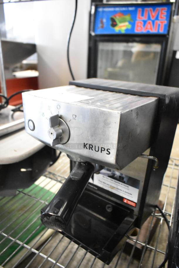 Krups XP524 espresso machine with portafilter; stainless steel housing, control dial. Used condition, 120V, 1 phase.
