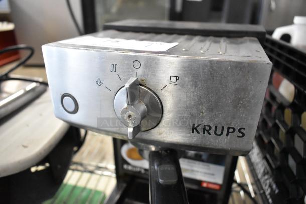 Krups XP524 espresso machine with portafilter, 120 volts, single group, visible controls, used condition.