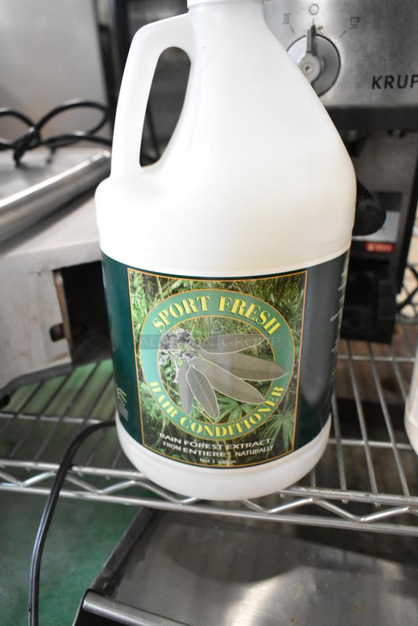Six jugs including Sport Fresh Hair Conditioner with rainforest extract. Contains 1 gallon. Unused condition.